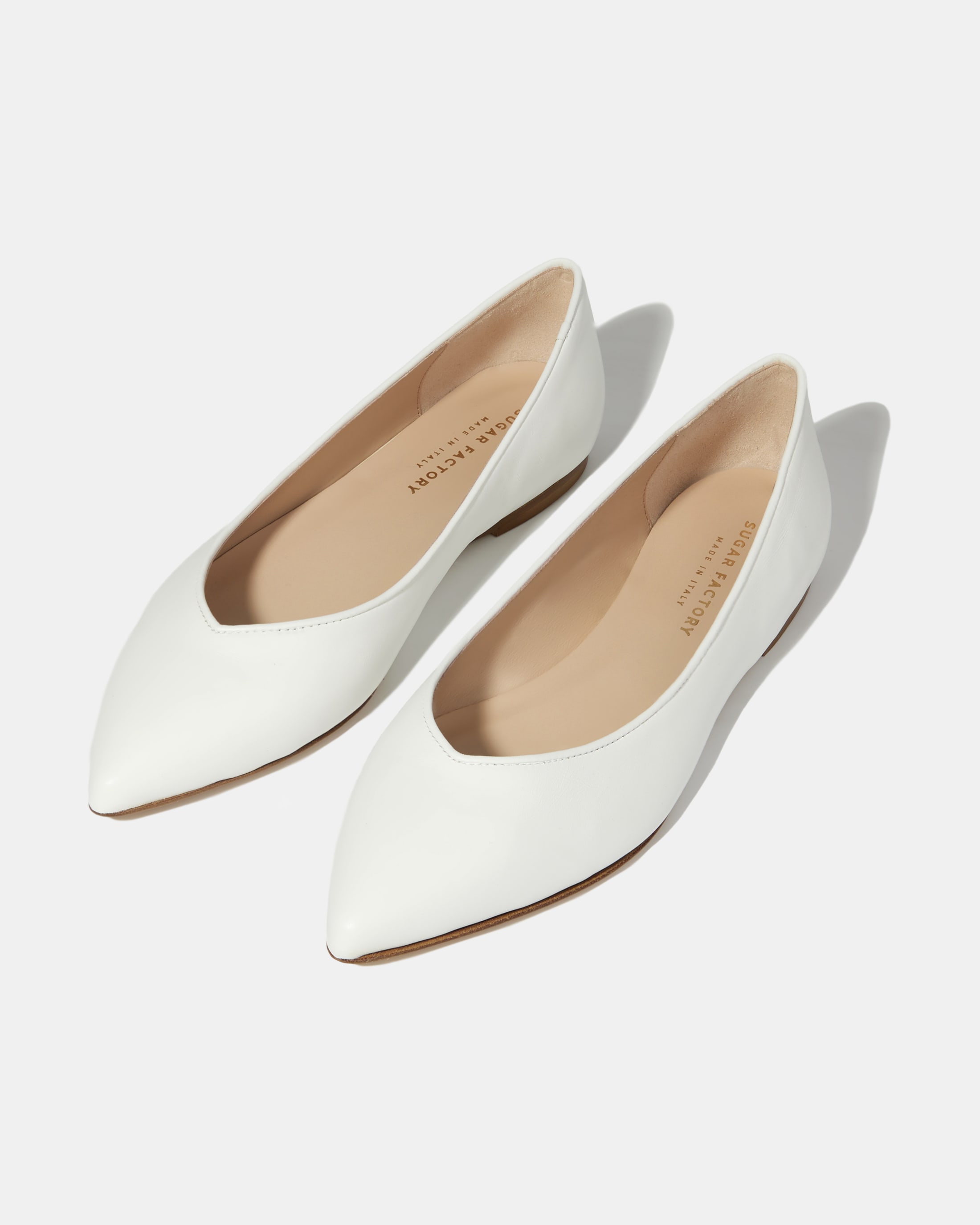 Белые балетки из натуральной кожи